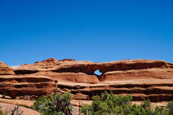 Arches National Park in April view of an arch off in the distance