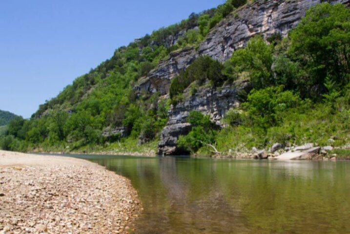 the rock bluffs and river while floating on the buffalo river