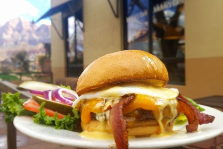 a burger with bacon at memes cafe one of the best restaurants in springdale utah