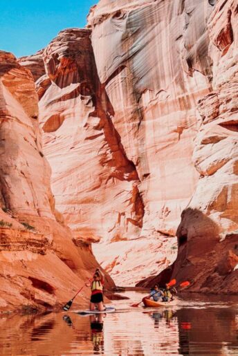 a person paddleboarding antelope canyon