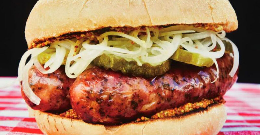 Sheboygan’s Perfect Bite: A Double Brat on a Hard Roll, Mustard & Onions