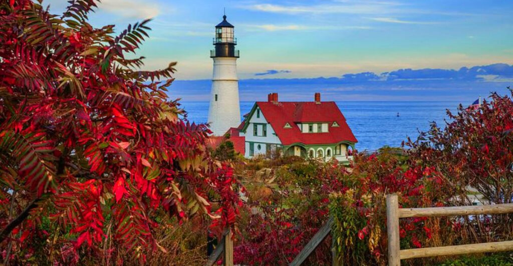 The Maine Town Where Lighthouses Glow Against Autumn Leaves