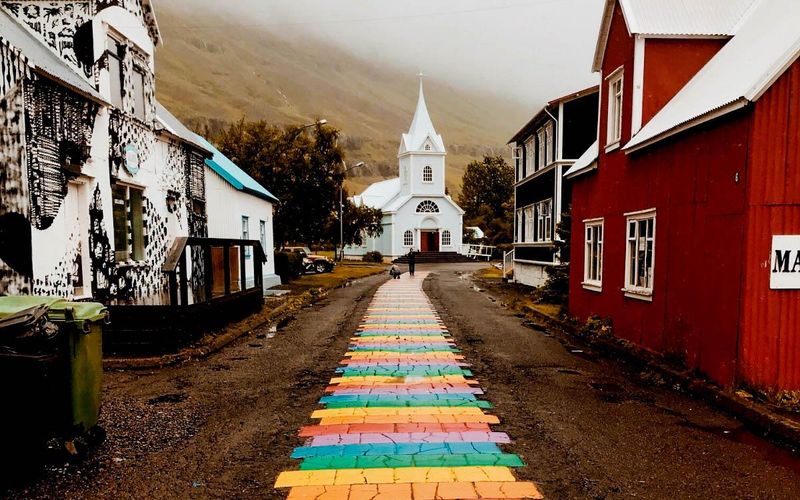 Seyðisfjörður’s Rainbow Street to the Blue Church