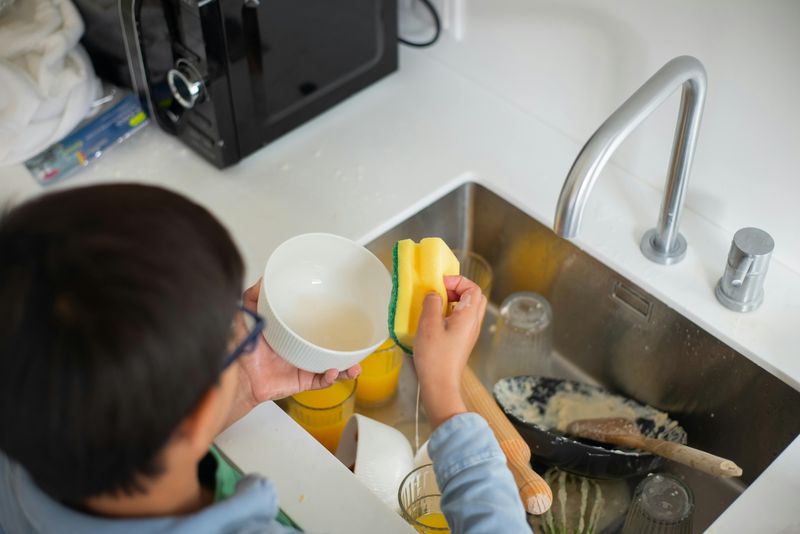 Hand-washing and towel-drying every dish