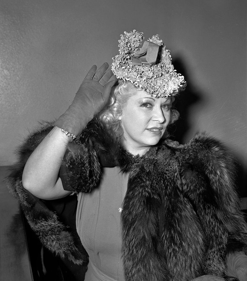Mae West — The knowing smile, the hourglass silhouette, and a quip that could stop traffic—pure vaudeville-to-film allure.