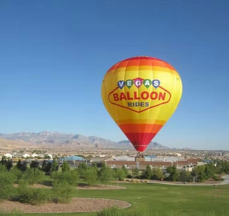 Float above the desert at sunrise in a hot-air balloon
