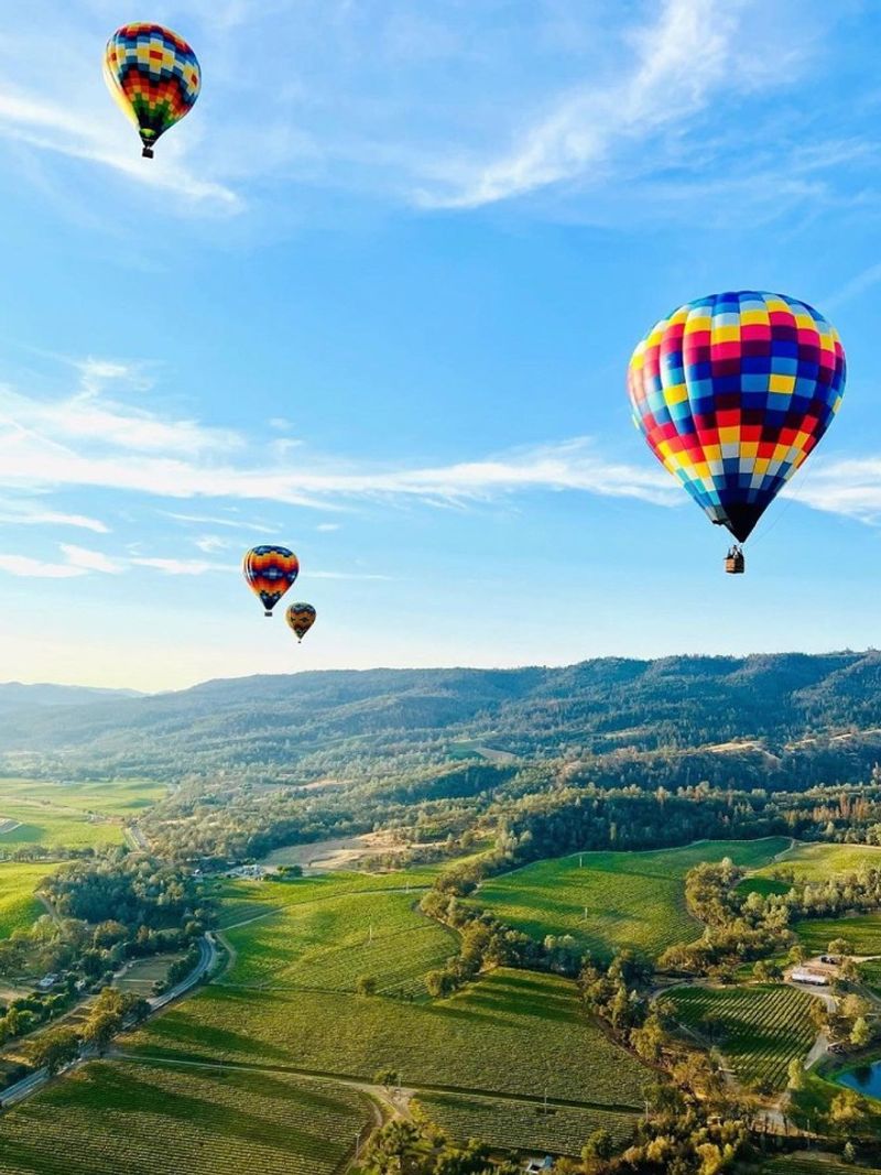 Float at sunrise in a hot-air balloon