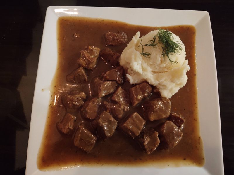 Beef Goulash Over Potato Pancakes