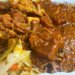 Harlem Hidden Gem Serves Curry Goat That Falls Right Off the Bone