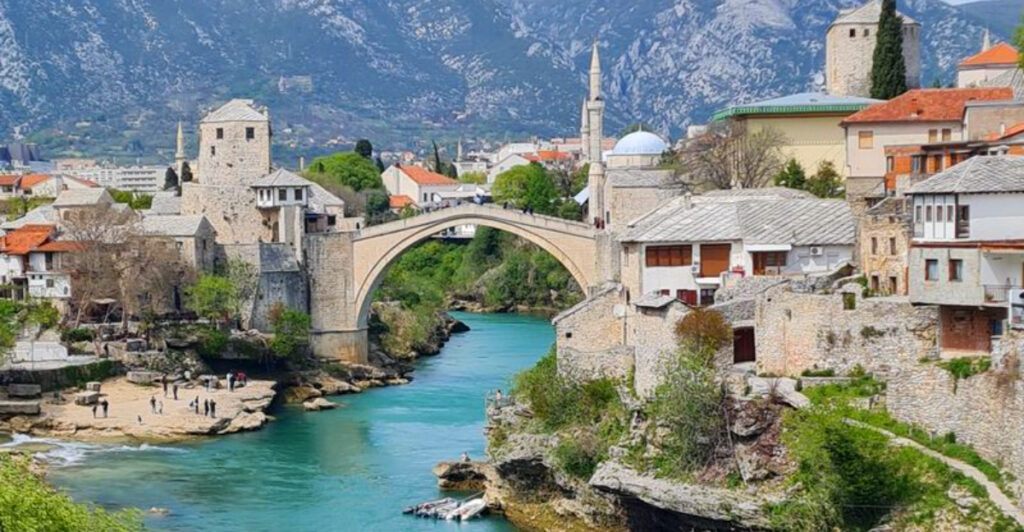 A River Colder Than Most Alpine Rivers Runs Through This City and the Bridge Jumps Are Next-Level