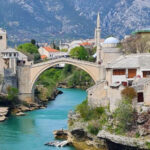 A River Colder Than Most Alpine Rivers Runs Through This City and the Bridge Jumps Are Next-Level