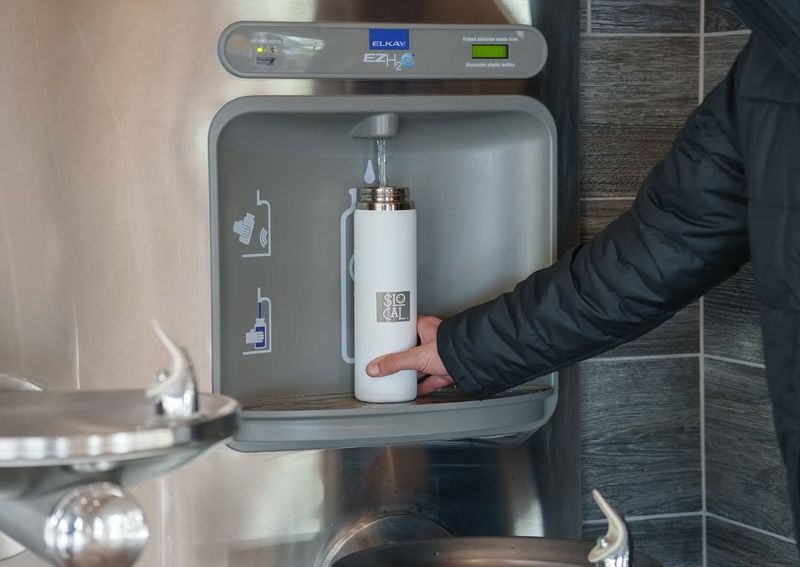 An empty reusable water bottle (fill after security)