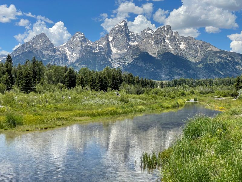 Catch a glassy morning reflection at Schwabacher Landing