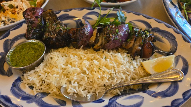 Beef Tenderloin Kebab Over Rice And Salad