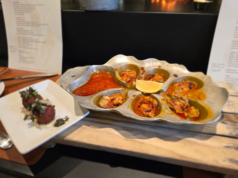 Wood fired oysters with chili butter