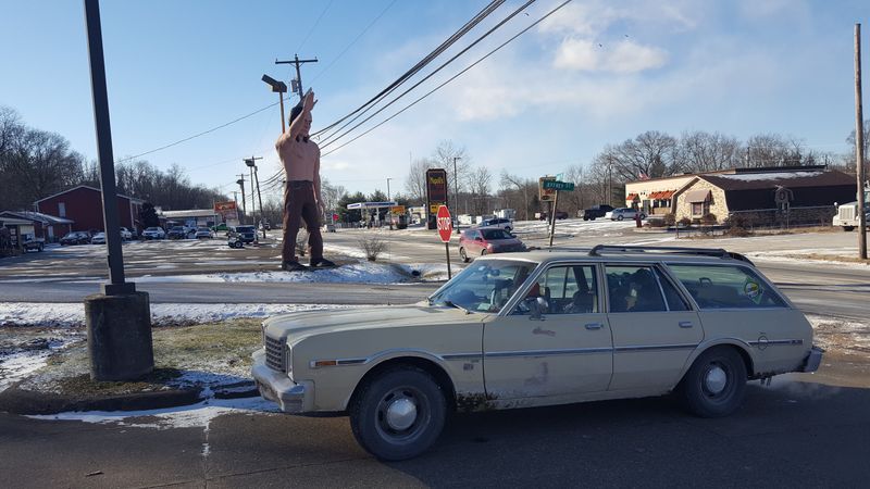 Giant fiberglass Muffler Men and statues