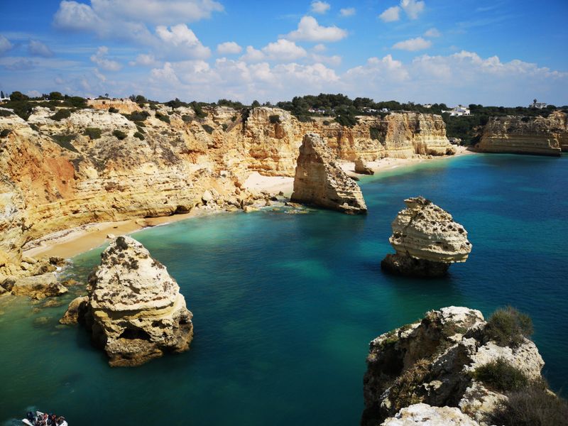 Explore Praia da Marinha - Iconic Cliffside Beach