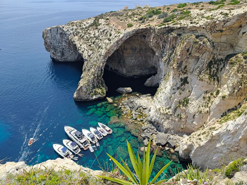 Do the Blue Grotto by boat on a bright day