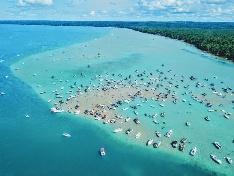 Wade Torch Lake’s Turquoise Sandbar
