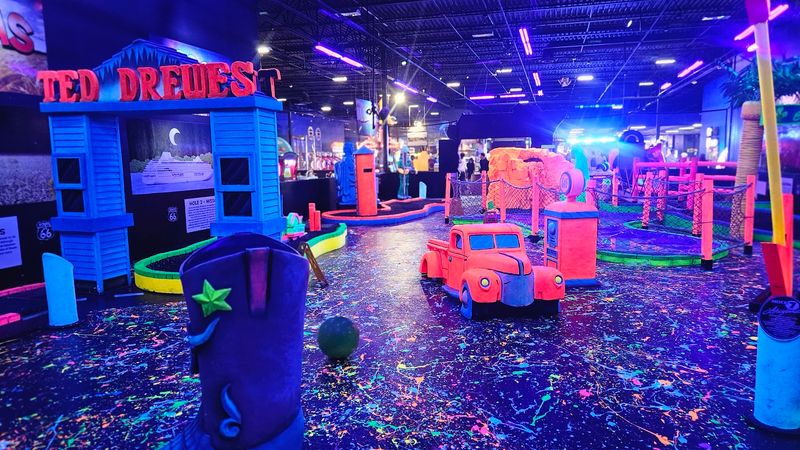 Mini Golf Through Glowing Obstacles