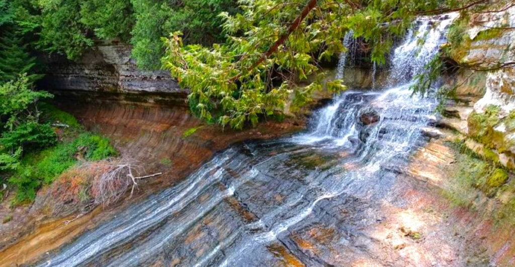A Stairway Through the Woods Reveals One of Michigan’s Most Stunning Falls