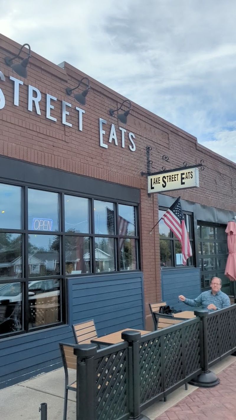 The Sunny Patio: Outdoor Dining with Red Umbrellas