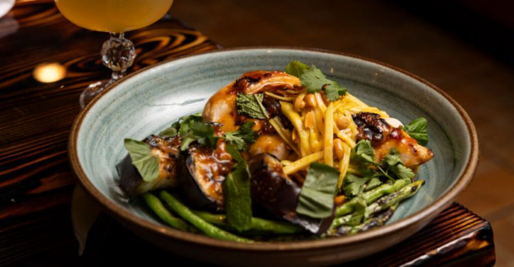 From Truffle Fries to Charcoal Cocktails, This South Florida Spot Might Be the Ultimate Hidden Gem