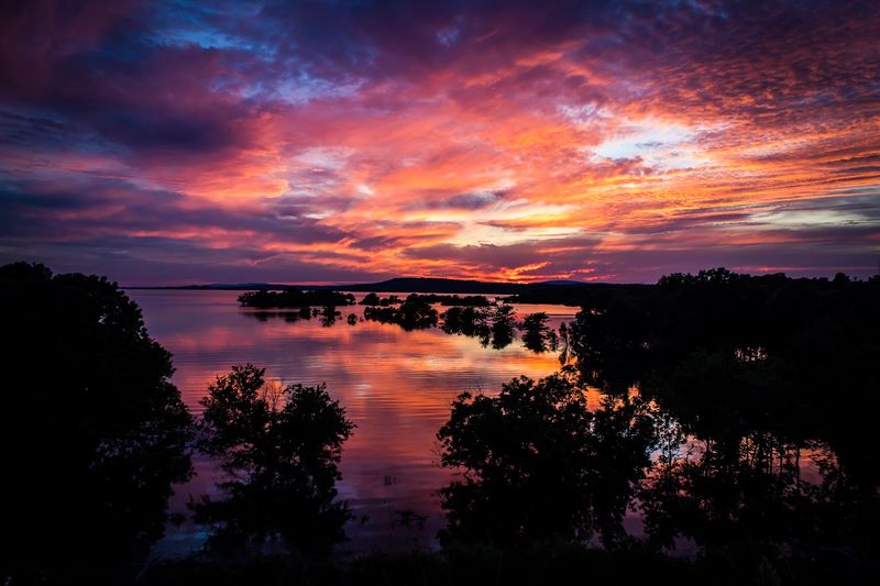 Sunrise and Sunset Skies Over the Water
