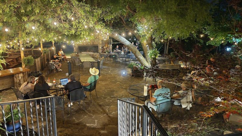 The Outdoor Patio With a Stone Fireplace