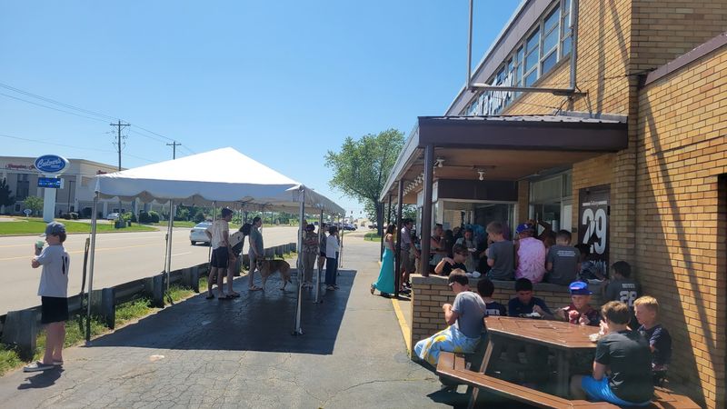 Picnic tables, parking lot, and real life