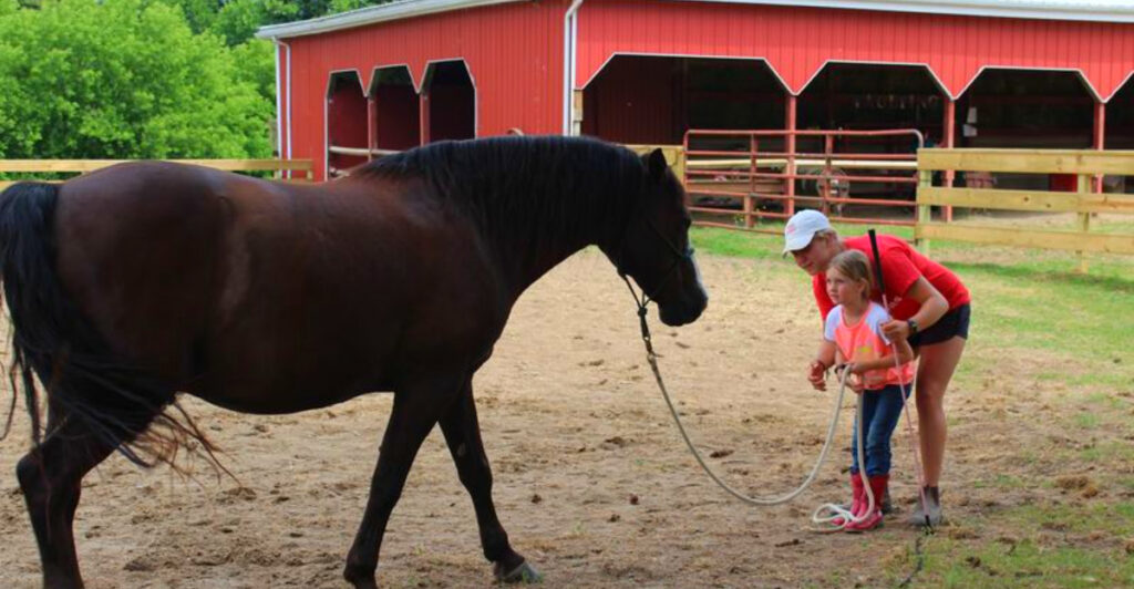 This Hidden Michigan Ranch Lets You Ride Horses, Feed Calves, and Live the Real Farm Life for a Week