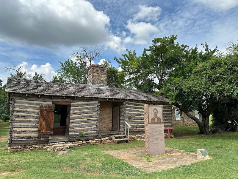 The Grounds, the Ruins, and the Reconstructed Cabins
