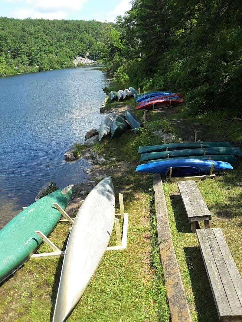 A Glacial Lake With Canoes and Kayaks Ready to Go