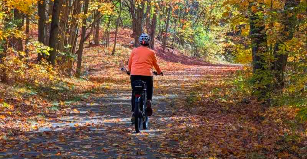 This 22-Mile Michigan Bike Trail Has Forest Canopies, Open Farmland, and an Ice Cream Stop Cyclists Love