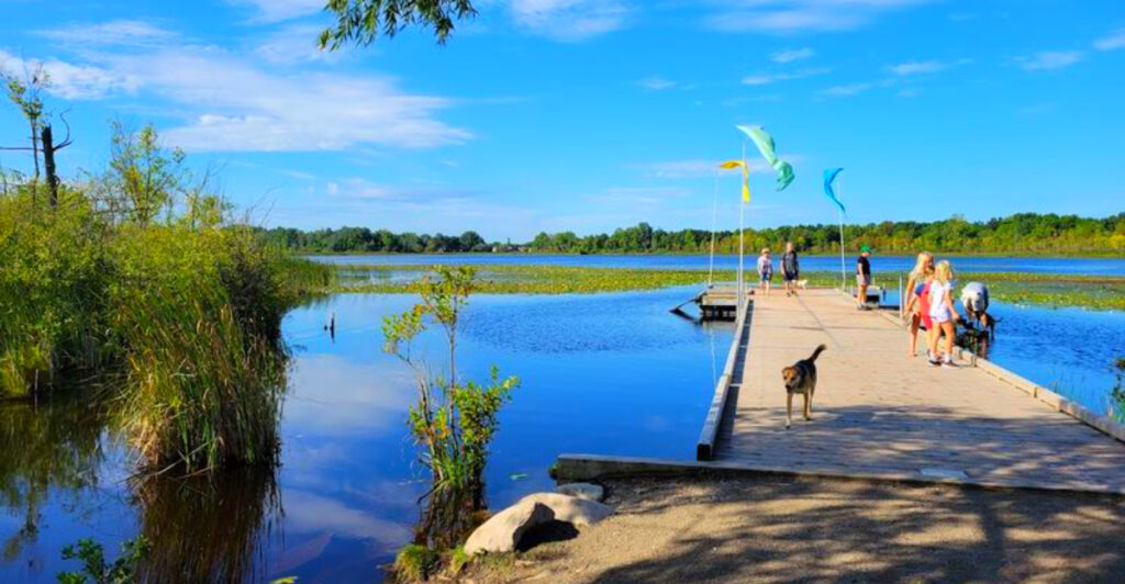 This 900-Acre Michigan Park Has a Massive Off-Leash Dog Area, Lake Swims, and Hills Worth the Climb