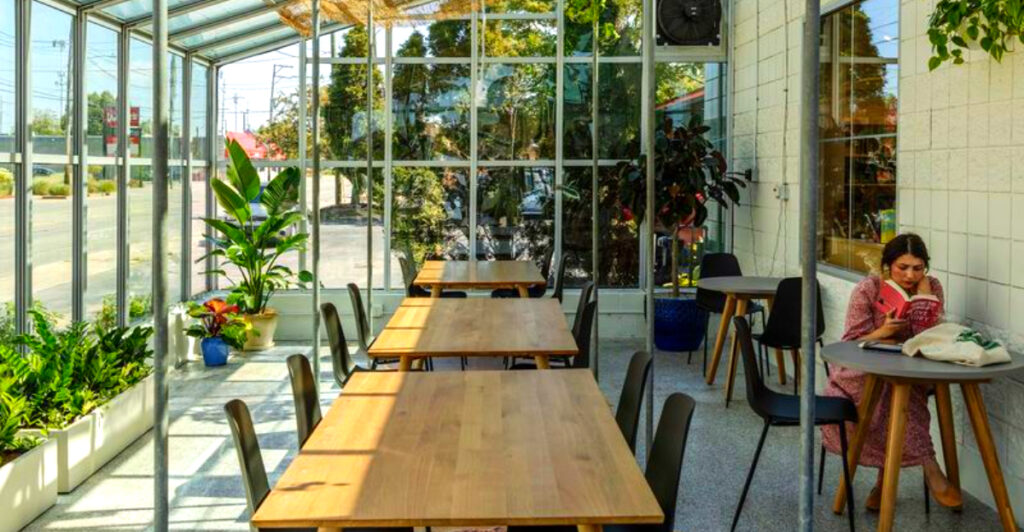 This Cozy Grand Rapids Spot Has Books, Lattes, and a Sunlit Greenhouse You Won’t Want to Leave
