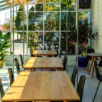 This Cozy Grand Rapids Spot Has Books, Lattes, and a Sunlit Greenhouse You Won’t Want to Leave