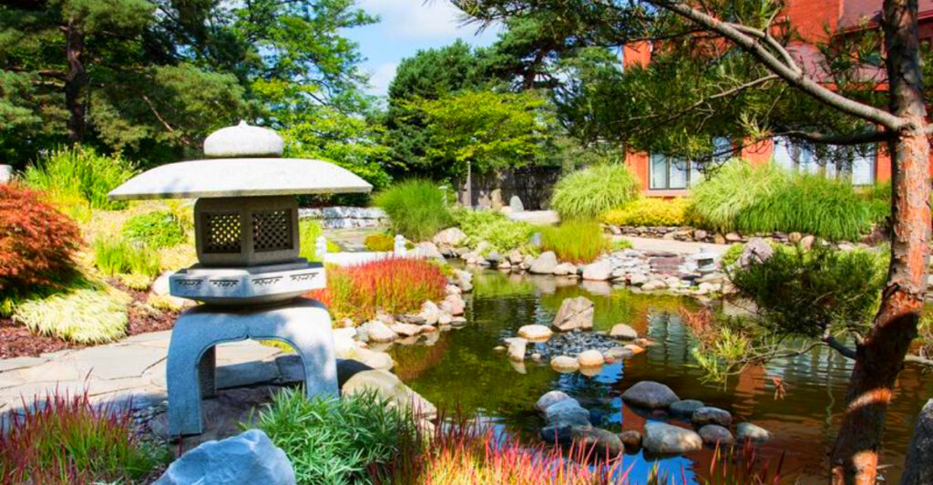 This Hidden Japanese Garden in Downtown Lansing Has Koi Ponds, Mini Bridges, and Zero City Noise
