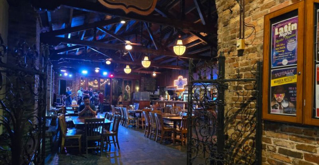 This Pensacola Hotspot Hides a Bourbon Street–Style Party Inside a Historic 1800s Warehouse