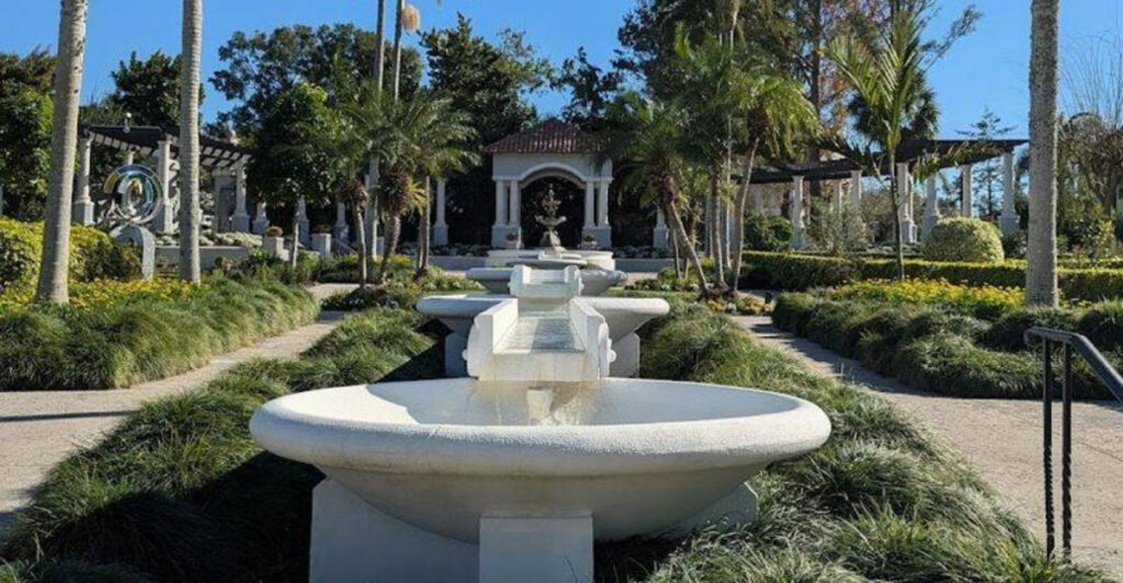This Stunning Lakeland Garden Feels Like a European Oasis Filled with Flowers, Fountains, and Lake Views