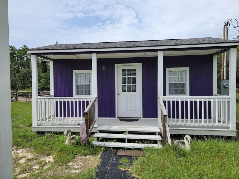 The Charming Gift Shop Inside a Purple Tiny House