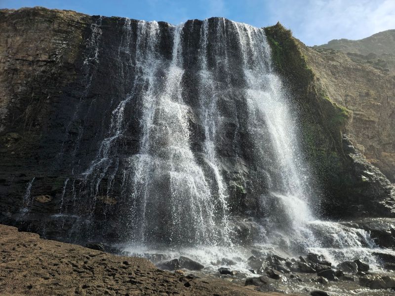 The Story Behind This Rare Coastal Waterfall