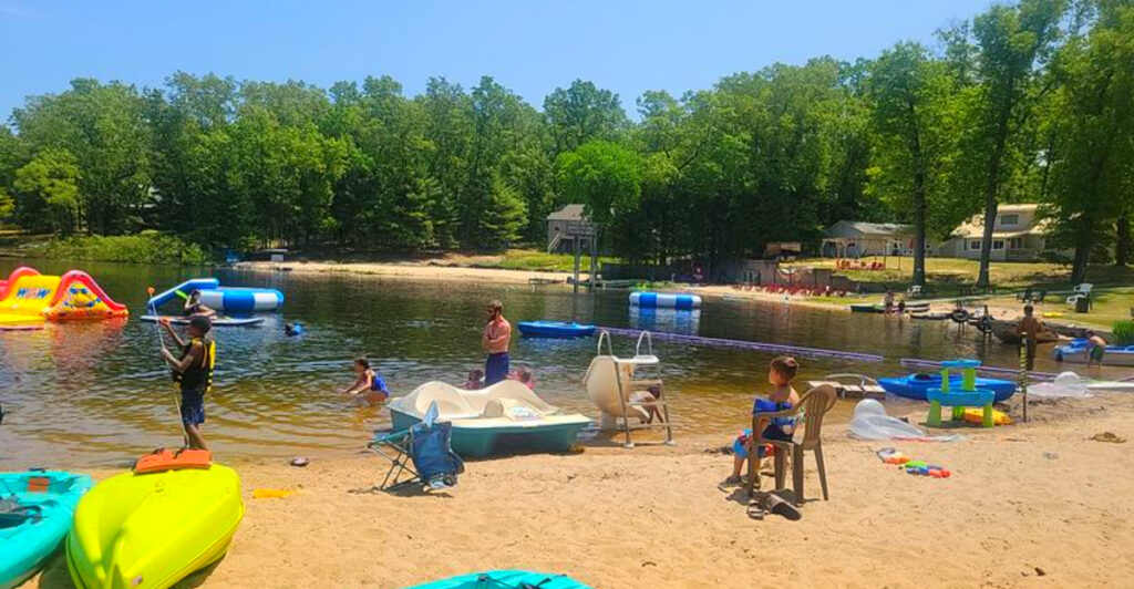 Hidden in Northern Michigan Is a Private Lakefront Cabin Retreat With a 50-Foot Water Slide and Zero Crowds