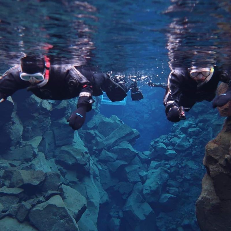 Swimming Between Tectonic Plates at Silfra, Iceland Swimming Between Tectonic Plates at Silfra, Iceland
