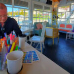 The Cozy Michigan Café Where Visitors Sip Lilac Lattes and Paint Watercolors by the Harbor