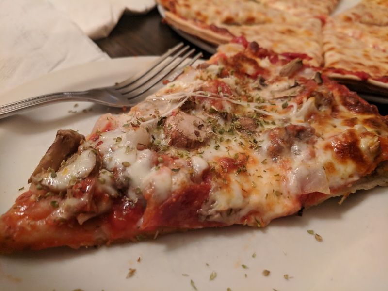 The Thin Crust That Defines the Experience The Thin Crust That Defines the Experience