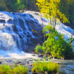 These Hidden Michigan Waterfalls Require Long Forest Drives, But the Views Are Absolutely Worth It