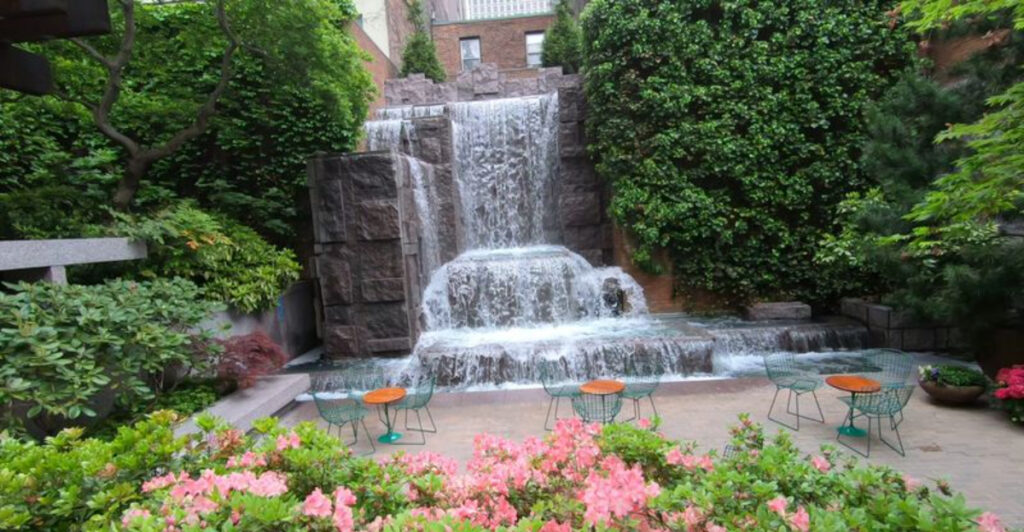 This Hidden Park In The Heart Of Midtown Manhattan Has A 25-Foot Waterfall and a Cafe