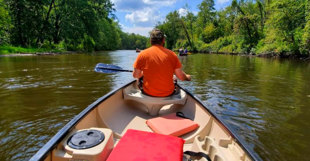 This Michigan Campground Lets You Kayak a Scenic River by Day and Fall Asleep Steps From the Water at Night
