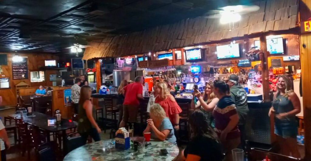 This Rustic Michigan Lodge Serves Crowd-Favorite Pizza, Loaded “Garbage Fries,” and Smoked Brisket